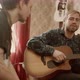 Man Playing Guitar and Singing Near Friend - VideoHive Item for Sale