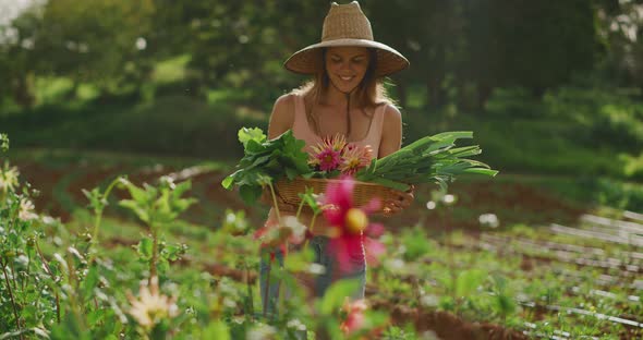 Woman holding organic vegetables alt