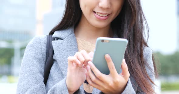 Woman use of smart phone in park