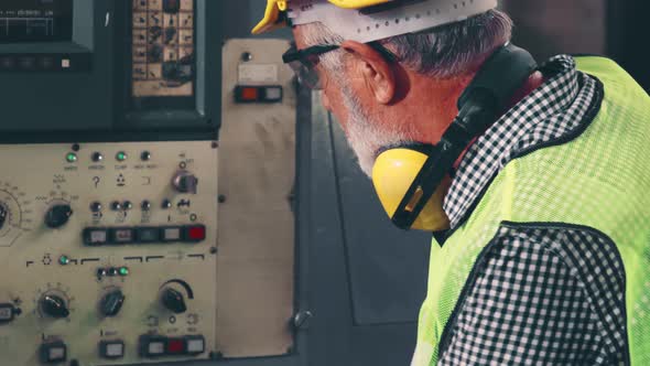 Smart Factory Worker Using Machine in Factory Workshop