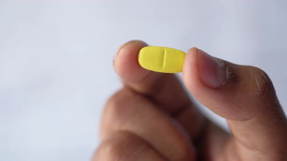 Close Up of Man Hand Holding Pills with Copy Space 