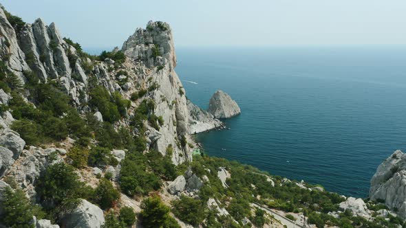 Aerial Fly Above Mountain Koshka of Simeiz with Diva Rock in Background