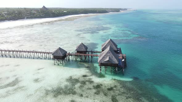 Aerial View of a House on Stilts in the Ocean on the Coast of Zanzibar Tanzania Slow Motion