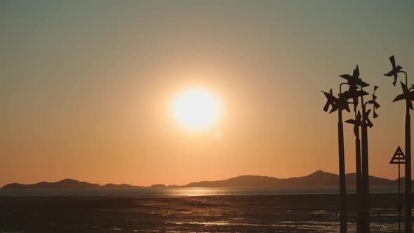 Sunset On The Mudflats With Pinwheel (Time Lapse)