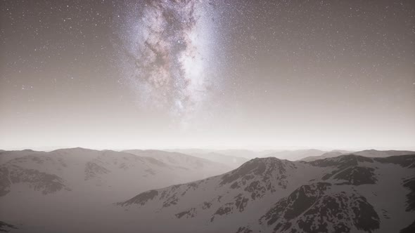 Milky Way Above Snow Covered Terrain alt