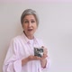 Portrait of Elderly Female in Casual Casual Wear Holding a Mug - VideoHive Item for Sale