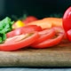 Salad leaves, cutted tomato, bell pepper and carrot on a wooden board - VideoHive Item for Sale