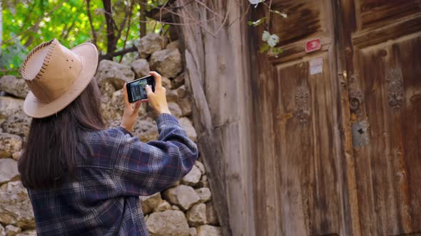 Photographer Taking Pictures Of Old Houses