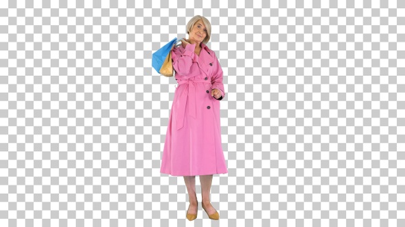Beautiful senior woman in trench coat, Alpha Channel