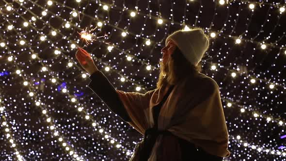 Pretty Girl Holding Sparkler in Her Hand