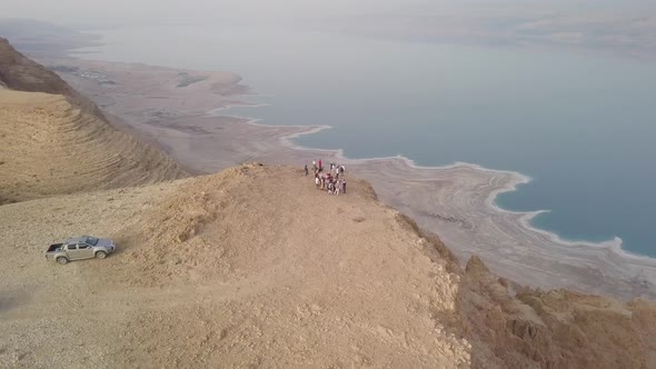 Group of people enjoying the scenic view of the Dead Sea