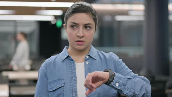 Indian Woman Checking Watch While Waiting