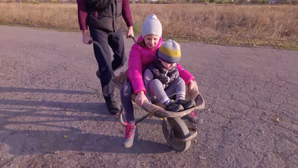 Children In A Wheelbarrow