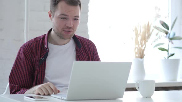 Online Video Chat on Laptop at Work