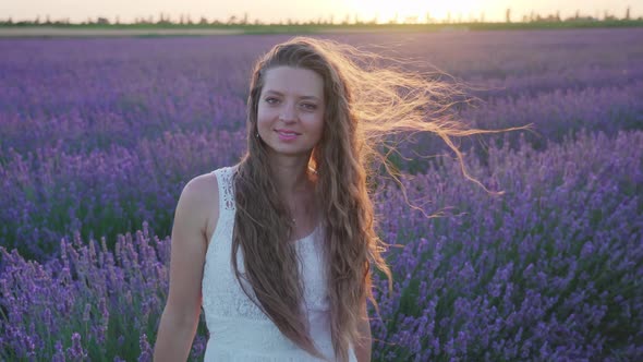 Girl in Front of the Lavender Field at Sunset