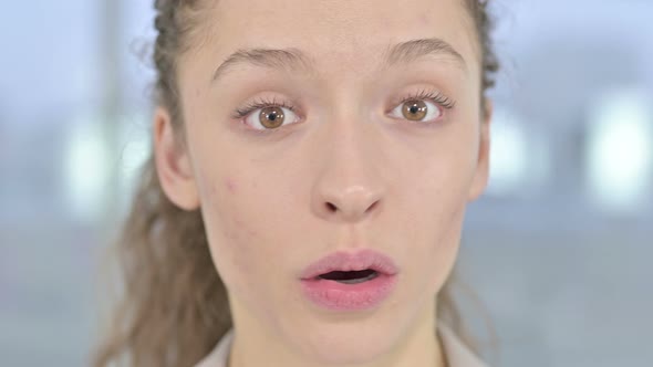 Close Up of Surprised Young Woman Feeling Shocked