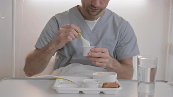 Person Eating Hospital Food