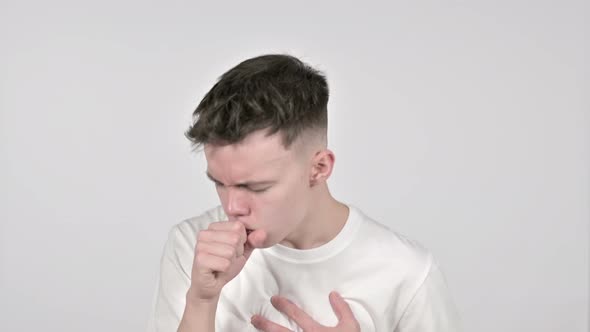 Sick Young Man Coughing on White Background