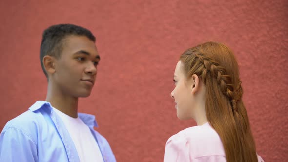 Multiethnic Couple of Teenager Tenderly Looking at Each Other, First Relations