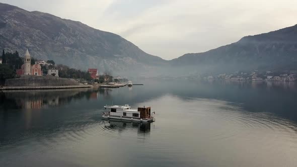 Aerial view of floating house in Boko-Kotorskaya Bay in Montenegro