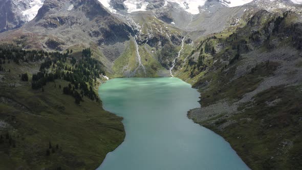 Aerial View at Icy Peaks and Mountains Altai Lake