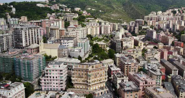 Aerial view over densely built and populous Genoa city, Italy