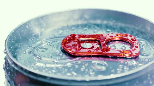 Aluminum Soda Tin Can Lid Cover of Soft Drink on Ice Goes Around the Circle