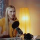 Close-up of Female Poet Reading Her Poem Into the Microphone in Home Recording Studio - VideoHive Item for Sale
