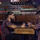 Guy joins with his friends to drink a beer at a bar in Patagonia Argentina - VideoHive Item for Sale