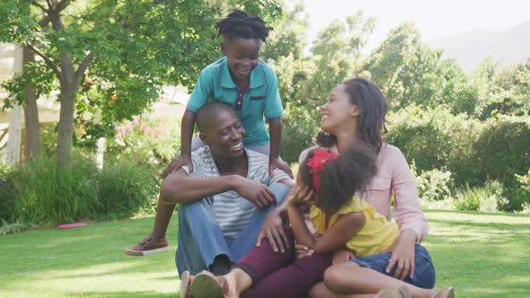 African American family spending time in the garden together