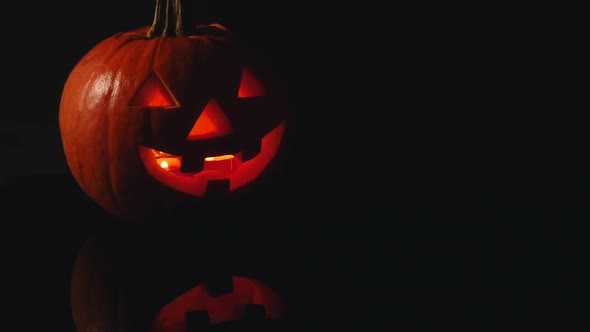 Halloween Glowing Pumpkin on Black Background