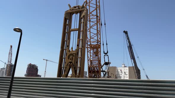 Crane using a Large Claw for Digging