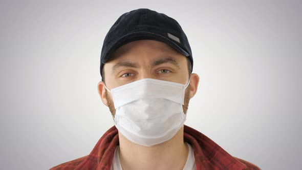 American Farmer Wearing the Protective Medical Mask Looking To Camera on Gradient Background