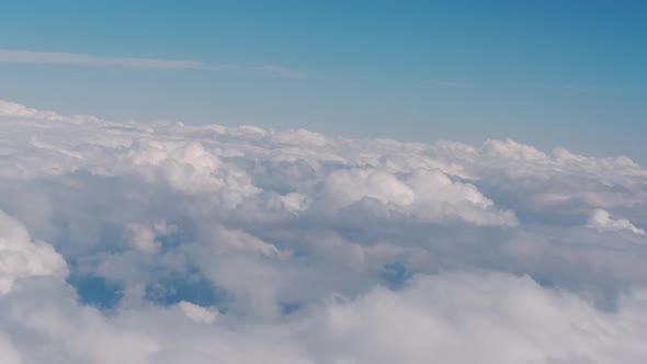 Big Clouds and Sky View From the Plane the Plane Flies High in the Sky Above the Clouds