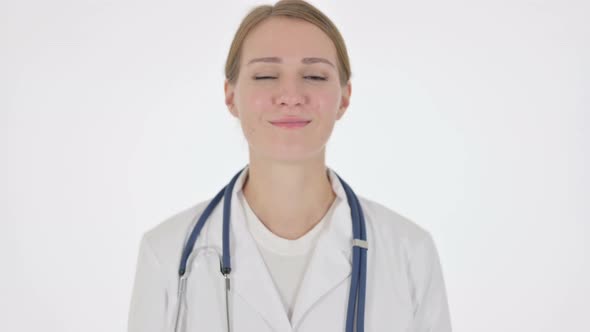 Female Doctor Shaking Head As Yes Sign on White Background