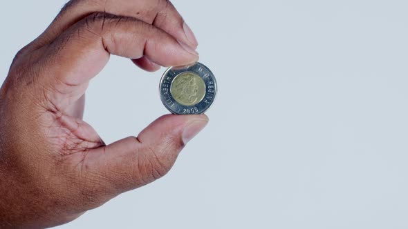 Hand Holding Canadian Dollar