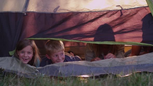 Family looking out from tent