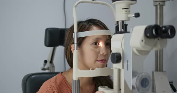 Woman check on eye in the clinic