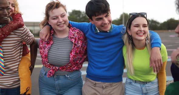 Young diverse people having fun outdoor laughing together