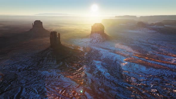 Magical First Sun Rays Illuminating Monument Valley at Sunrise Scenic Winter