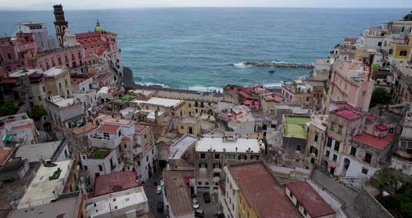 Flight over centre of cliffside town looking out over Tyrrhenian Sea, Amalfi