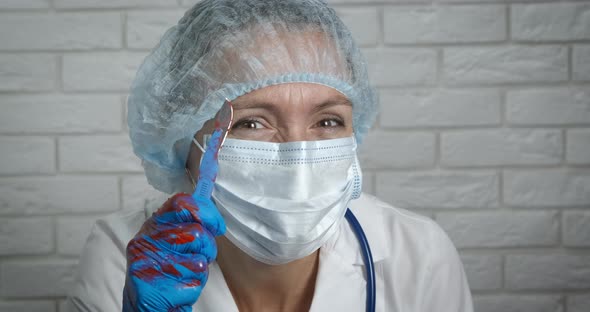 Doctor holding a scalpel.
