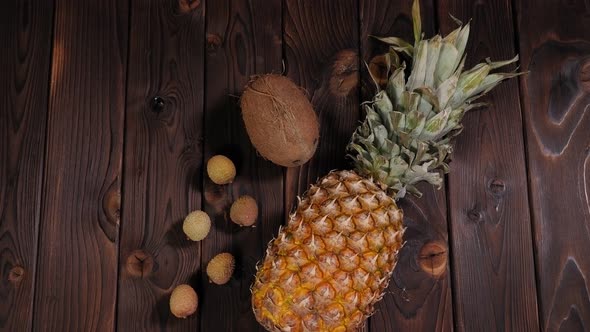 Closeup of Pineapple Coconut and Lychee on a Wooden Background