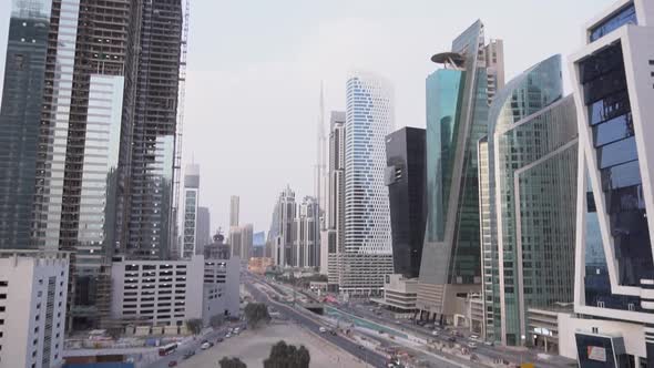 Slow Motion: Dubai City Skyline with Skyscrapers and buildings under construction