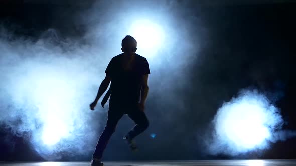 Young Hiphop Dancer Making a Move, Jump, Smoke, Silhouette, Slow Motion