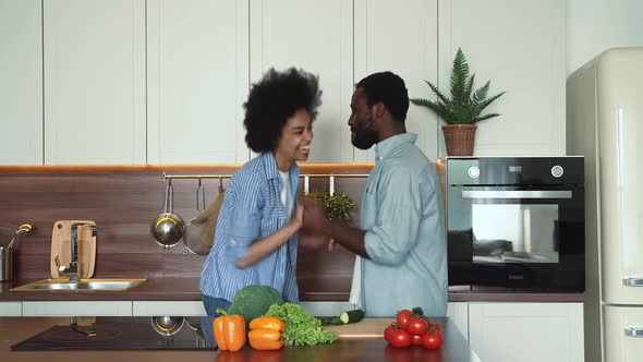 African american couple preparing food