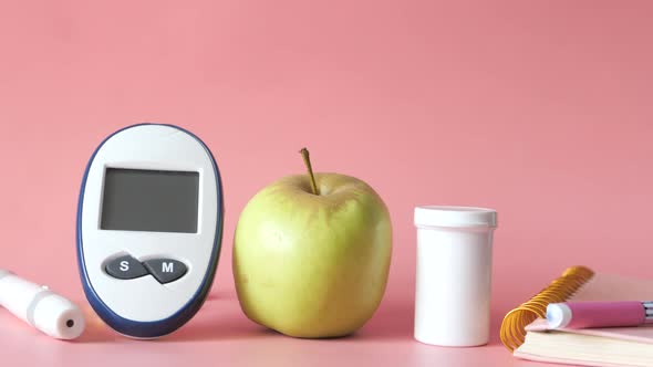  Diabetic Measurement Tools, Apple on Pink Background 