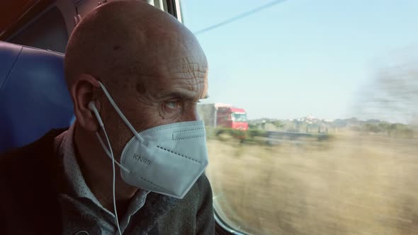 Old Man Looking Out the Train Window