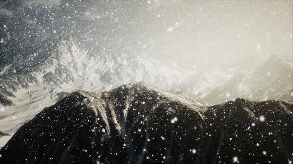 Heavy Snowing Focused on the Snowflakes Mountains in the Background