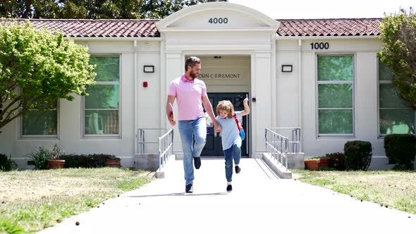 Happy Dad and Kid Running Home After School Slow Motion First Grade